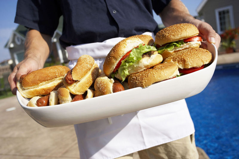 tray of hamburgers and hot dogs