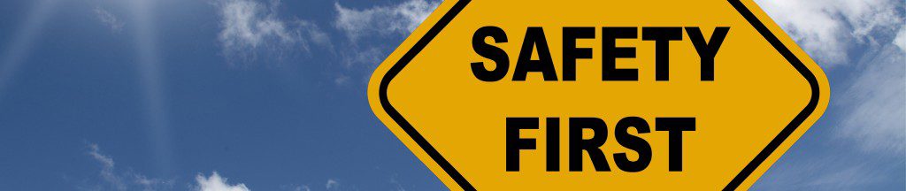 yellow road sign safety first