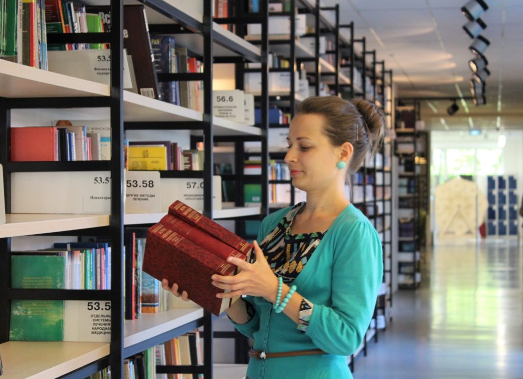 girl with books and shelves